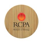 A round bamboo charger featuring a logo, designed as a wireless fast charger for phones.