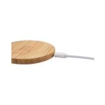 A bamboo wireless charger in a circular shape with a white charging cable attached.