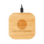 A square bamboo wireless charger with a cable attached and a logo engraved on the surface.