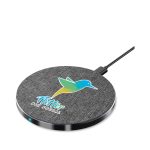A round wireless charger in grey with a fabric texture, featuring a logo and a charging indicator light.