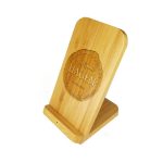 A bamboo wireless charger stand with a circular logo. The design features a smooth, natural finish.