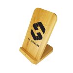 A bamboo wireless charger with a slanted design, featuring branding on the front.