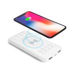 A wireless power bank in white, featuring a sleek design with a charging smartphone above it, illustrating charging capability.