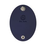 A navy oval cable wrap with a metal attachment hole and a logo. Features a smooth surface.