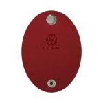 A red oval-shaped cable tidy featuring a logo and a keyring attachment point.