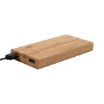 A bamboo wireless power bank in natural wood tones, featuring USB ports and a charging cable attached.
