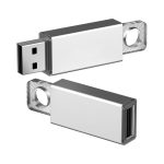 A silver flash drive with a USB connector and a hole for attachment. It has a sleek, metallic design and a logo.