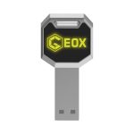 A silver and black LED flash drive with a hexagonal shape and a logo.
