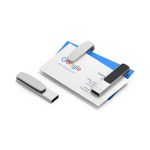 A sleek silver Mosman LED flash drive rests on a business card, featuring a minimalist design.