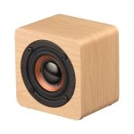 A wooden speaker with a square design and a circular speaker grille in the front, primarily light brown in colour.