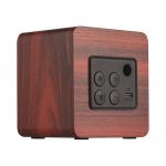A square speaker with a wood-like finish, featuring control buttons and a USB port. It has a minimalist design.