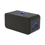 A black wireless charging speaker with a mesh front and a logo on top, designed for phone compatibility.