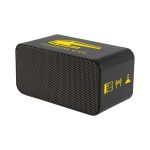 A black wireless charging speaker with a textured front, featuring a yellow logo and icons.