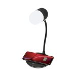 A wireless charging sound lamp with a black base and curved neck, featuring a white light and a smartphone on the charging pad.