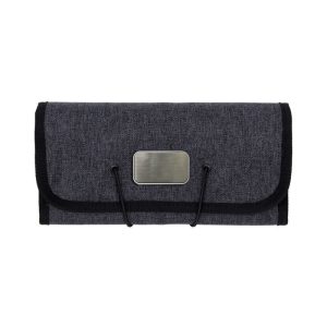 A grey folio accessory roll with a clasp closure, featuring a metallic logo and black trim.