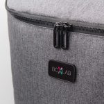 A grey backpack with a zipper and a logo tag. The fabric has a textured appearance.
