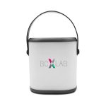 A portable white LED speaker with a black handle and branding on the front.