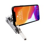 A silver keyring device holds a smartphone at an angle, showcasing its screen. The phone displays a colourful wallpaper.