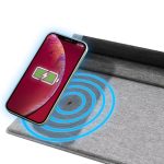A grey mouse pad with wireless charging capability, featuring a phone displaying a charging icon above it.