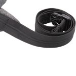 A grey anti-theft sling bag with an adjustable strap and a clip closure. It features a simple design and is quite compact.