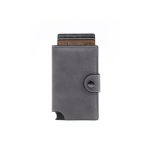 A grey vegan leather wallet with a button closure and several cards partially visible. It features a branding logo.