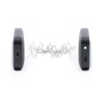 A pair of black Nano Vegan Wireless Speakers with sound waves visually represented between them.