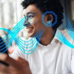 Black Aria Pro ENC TWS Earbuds in use by a smiling man, featuring a branding logo and abstract blue design elements.