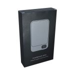 A grey power bank in a sleek black box featuring a logo and a digital display for battery level.