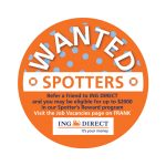 An orange circular promotional sticker with white text and a logo, featuring polka dots and a "Wanted" theme.