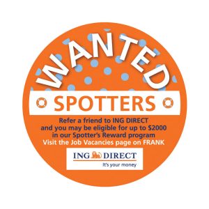 An orange circular promotional sticker with white text and a logo, featuring polka dots and a "Wanted" theme.
