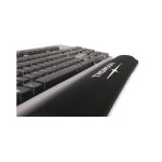 A black gel keyboard wrist rest positioned in front of a black keyboard, featuring a logo on the surface.
