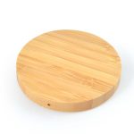A round bamboo wireless charger featuring a smooth, natural wood finish.