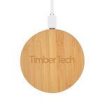 A round bamboo wireless charger in natural wood finish, featuring a logo and connected to a white charging cable.
