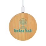 A round bamboo wireless charger in natural wood tones with a logo on the surface. Connected via a white cable.