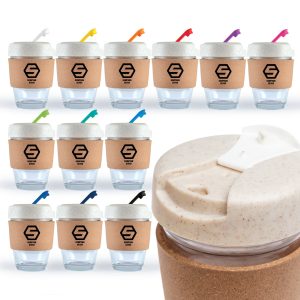 A collection of reusable coffee cups with cork bands and colorful lids, featuring a logo on each cup.
