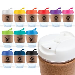 A reusable coffee cup with a cork band, featuring a variety of lid colors including white, red, pink, green, blue, and black.