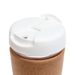 A reusable coffee cup featuring a cork band and a white lid with a sipping opening.