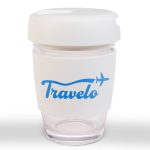 A reusable coffee cup with a flip lid, featuring a clear body and a white silicone sleeve, has a logo.