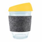 A reusable coffee cup featuring a transparent body, a bright yellow silicone lid, and a gray RPET band for insulation.