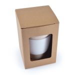 A reusable coffee cup packaged in a cardboard box with a clear window, featuring a silicone band around the base.