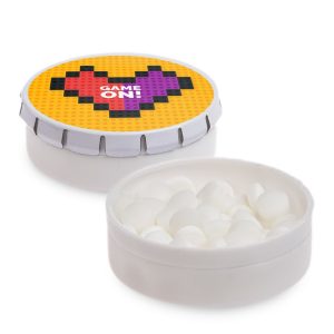 A white mint tin featuring a colorful lid with a heart design, filled with white mint candies.
