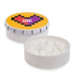 A white mint tin featuring a colorful lid with a heart design, filled with white mint candies.