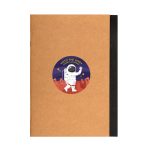 A brown A5 notebook with a black spine and a colorful astronaut sticker on the front.