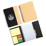 A spiral-bound notebook with a black cover, containing lined pages, sticky notes, and a logo.
