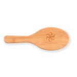 A bamboo hair brush with an engraved logo on the handle.