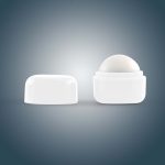A Cube Lip Balm container with a smooth, rounded balm on top and a white, square-shaped base.
