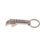 A drink bottle opener keytag in silver with a keyring attachment, featuring a brand logo.