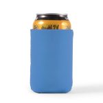 A drink can is nestled in a blue stubby cooler, designed to keep beverages cold.