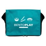 A teal cooler bag with a black strap, featuring a logo and various food graphics.