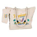 A natural canvas tote bag with rope handles and a tropical beach graphic, featuring a matching pouch.